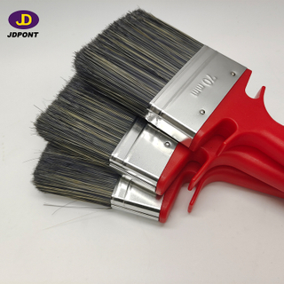 Paint brush with red plastic handle